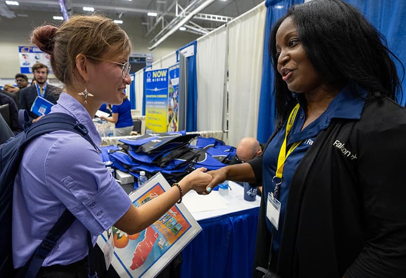 Woman meeting with recruiter at Career Expo.