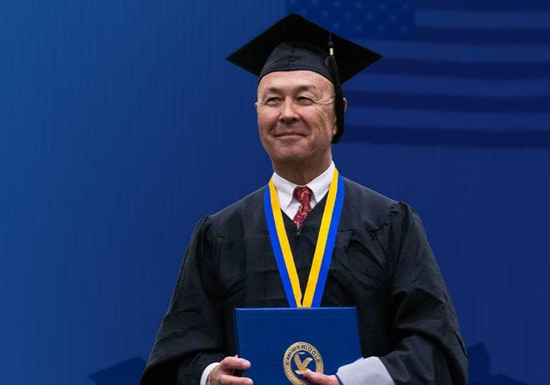 Graduate holding diploma 